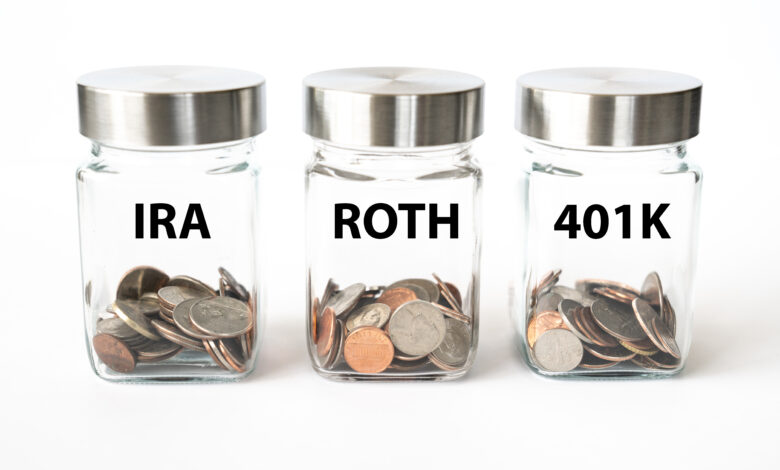 Jars with coins for retirement savings in Roth, 401K and IRA accounts
